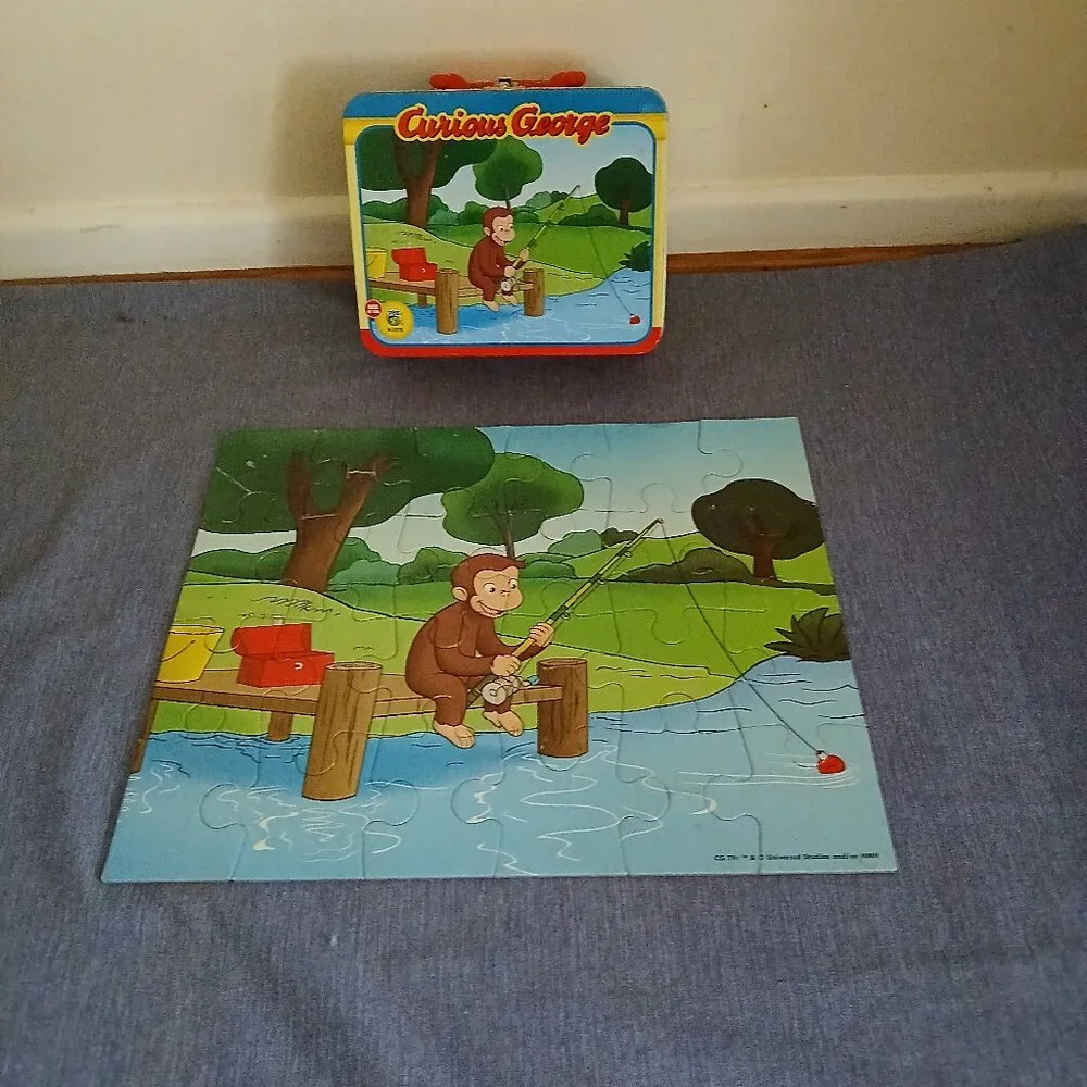 Curious George  Jizsaw puzzle 24 pieces in metal Tin Used